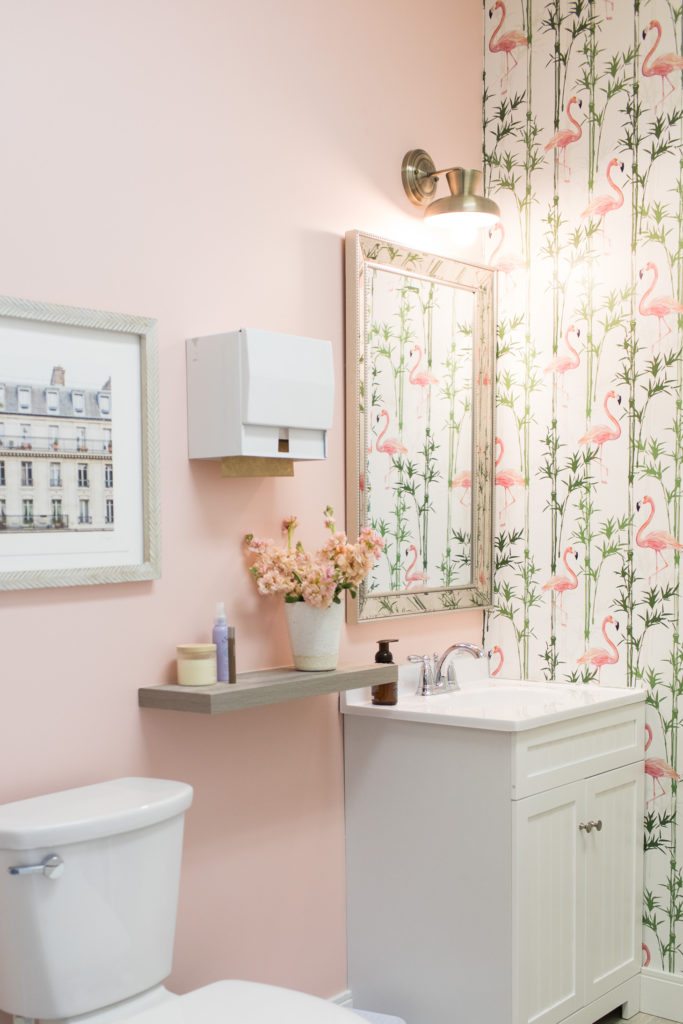 The public washroom at the Mamas For Mamas Charity with Tropic Like It's Hot Wallpaper with Flamingos on the wall. Wallpaper designed by Jillian Harris and sold by Milton & King