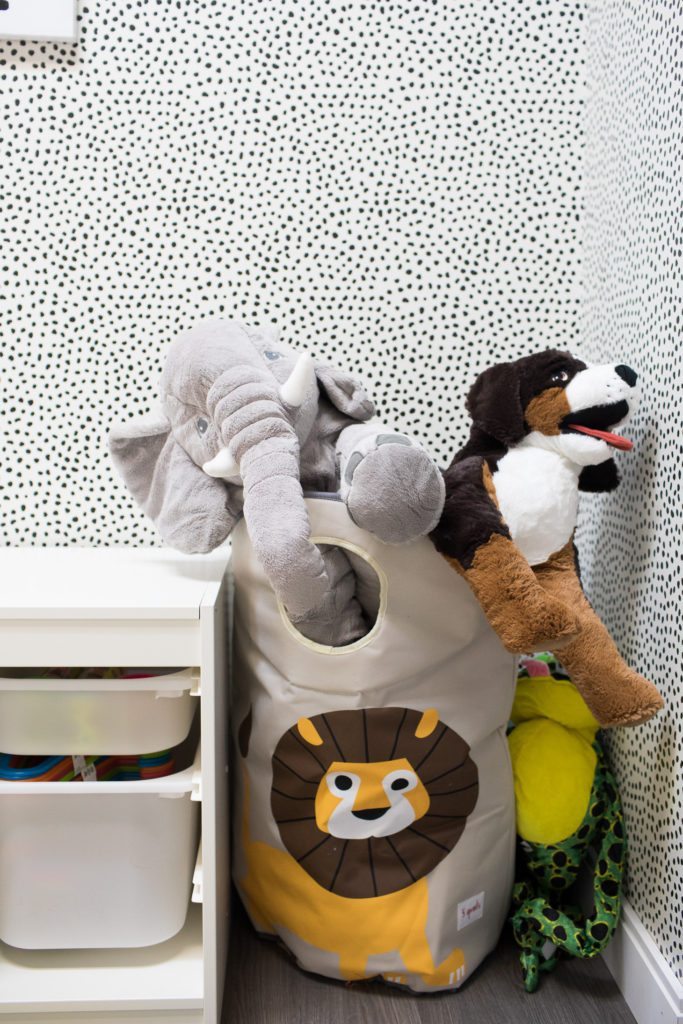 stuffed animals in the playroom at the Mamas For Mamas Charity in front of Leo's Spots Wallpaper designed by Jillian Harris and sold by Milton & King